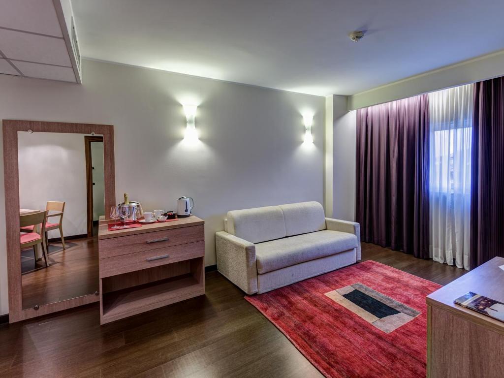 Postel nebo postele na pokoji v ubytování Hotel Capital