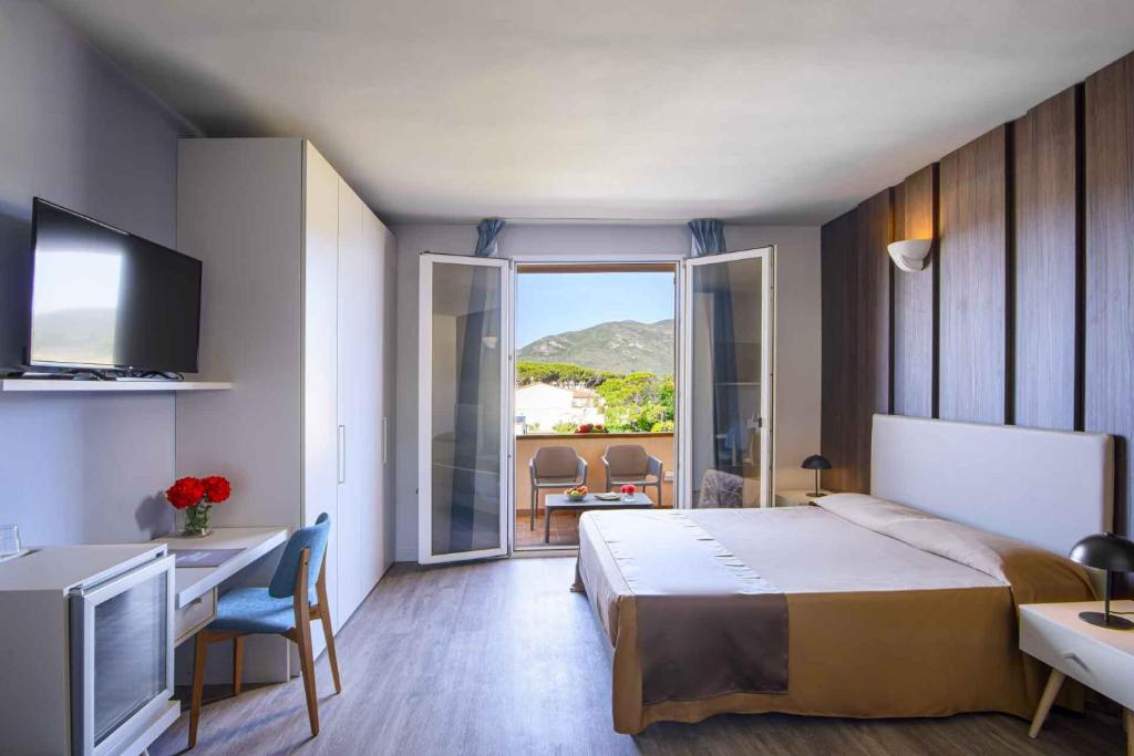Posteľ alebo postele v izbe v ubytovaní Hotel Riva del Sole