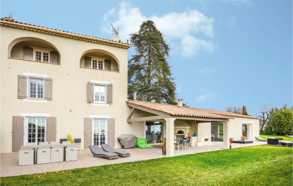 an exterior view of a house with a yard at Awesome Home In La Gaude With Kitchen in La Gaude