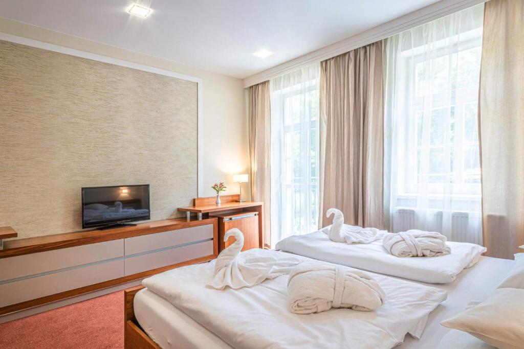 Postel nebo postele na pokoji v ubytování Hotel Reza