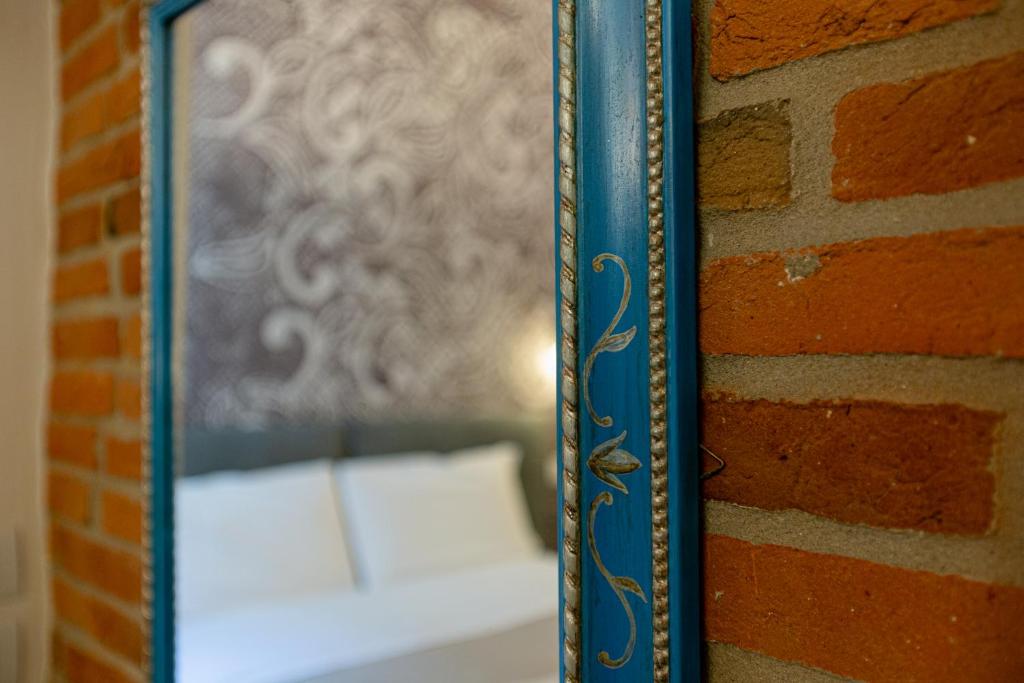 Postel nebo postele na pokoji v ubytování Palazzo di Giulietta - Juliet's Palace Verona
