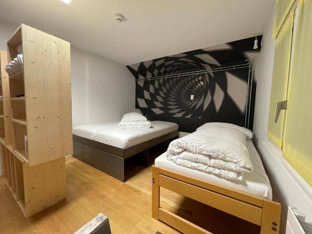 Postel nebo postele na pokoji v ubytování Boutique Hotel BS16 before Bern City Parking gratis