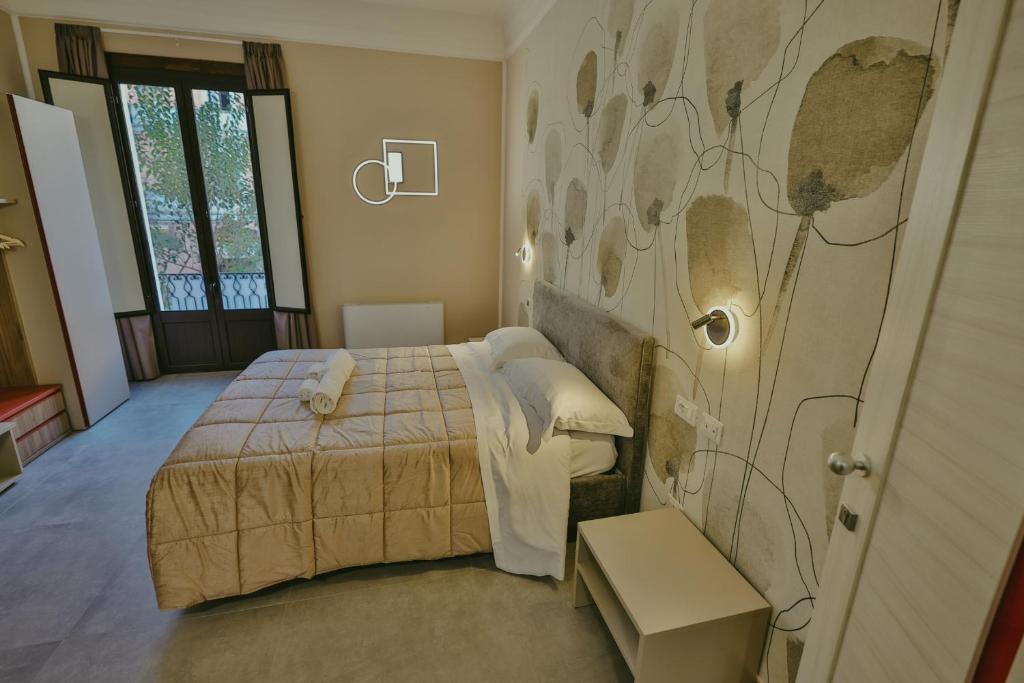 Postel nebo postele na pokoji v ubytování Brettia Guest Rooms