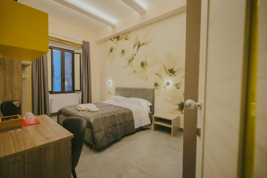 Postel nebo postele na pokoji v ubytování Brettia Guest Rooms