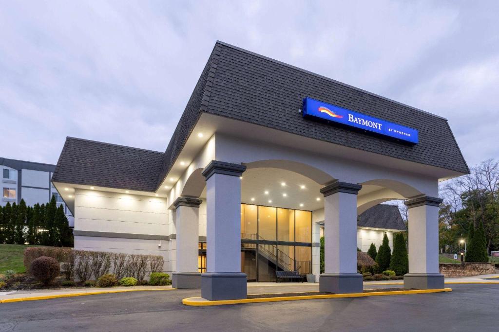 a building with a sign on top of it at Baymont by Wyndham White Plains - Elmsford in Elmsford