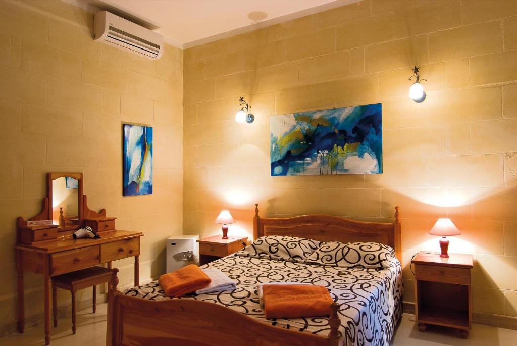 Postel nebo postele na pokoji v ubytování Djar Ta Menzja 3 Holiday Home
