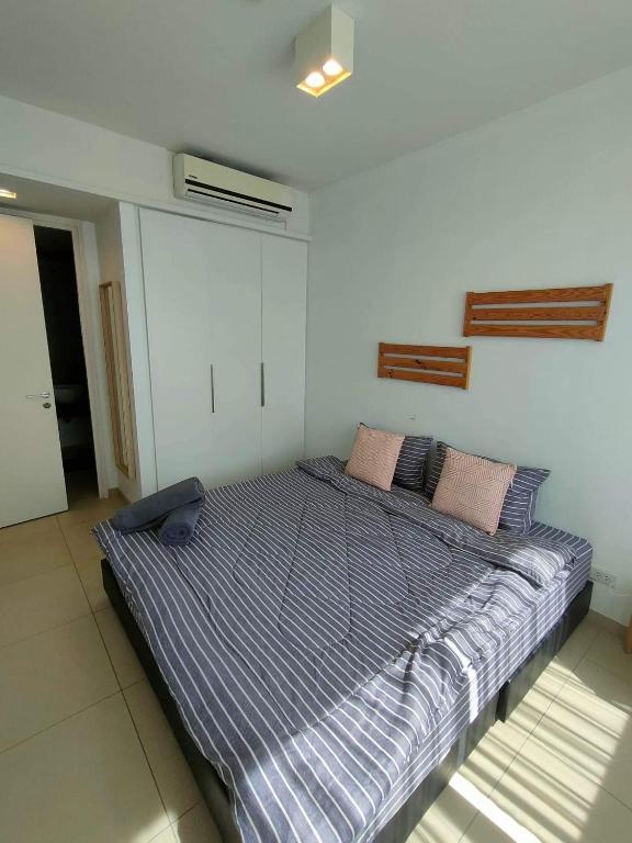 Postel nebo postele na pokoji v ubytování unixx seaview