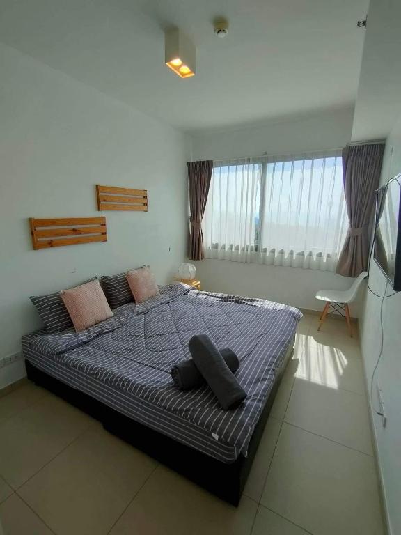 Postel nebo postele na pokoji v ubytování unixx seaview