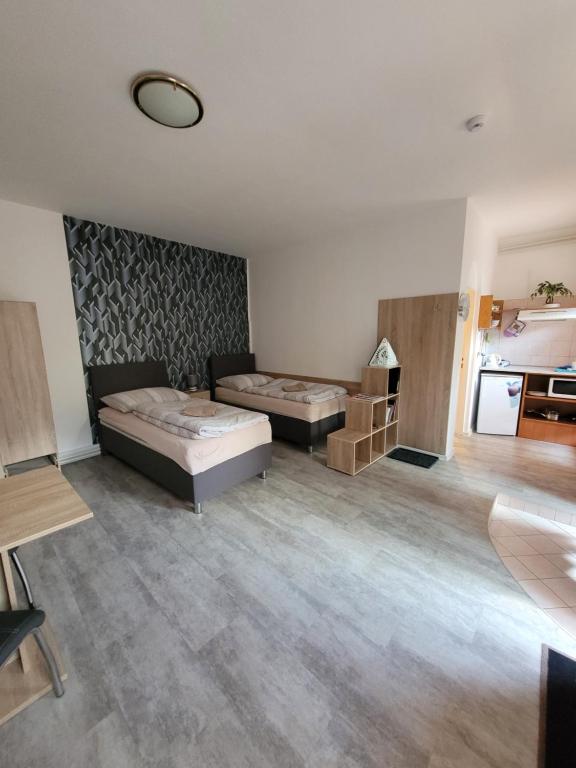 Postel nebo postele na pokoji v ubytování Apartmány Brno