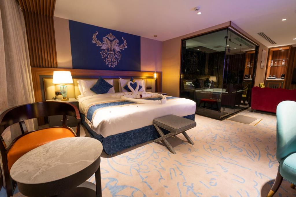 Postel nebo postele na pokoji v ubytování Najm aris hotel
