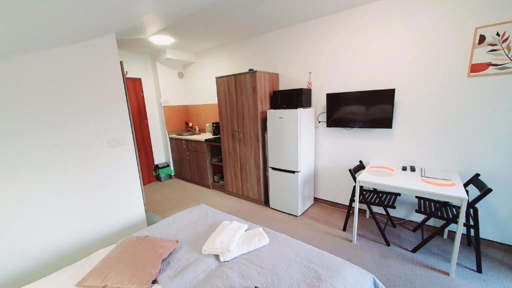 TV a/nebo společenská místnost v ubytování Holiday Family