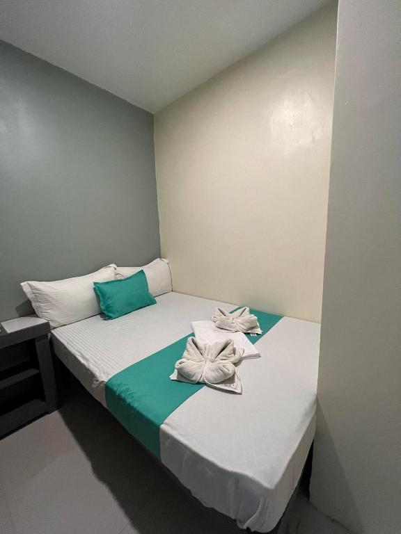 Łóżko lub łóżka w pokoju w obiekcie Laule'a Hostel