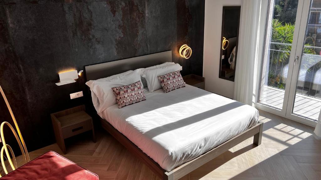 Postel nebo postele na pokoji v ubytování Patriziella 4 Rooms