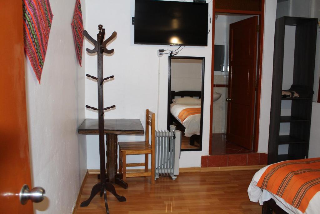 Postel nebo postele na pokoji v ubytování KAARO HOUSE CUSCO