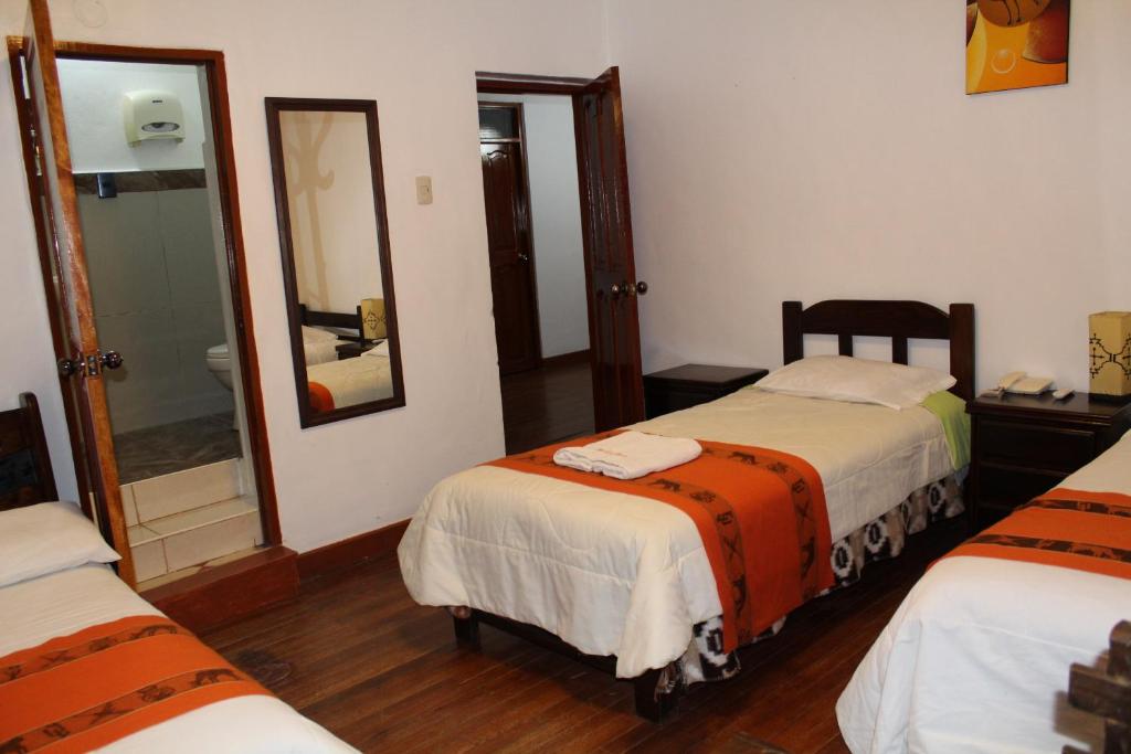 Postel nebo postele na pokoji v ubytování KAARO HOUSE CUSCO