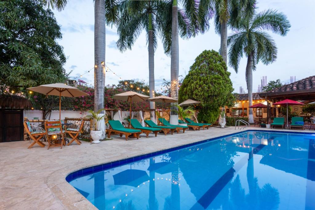 Bazén v ubytování Entre Palmas Casa Hotel nebo v jeho okolí