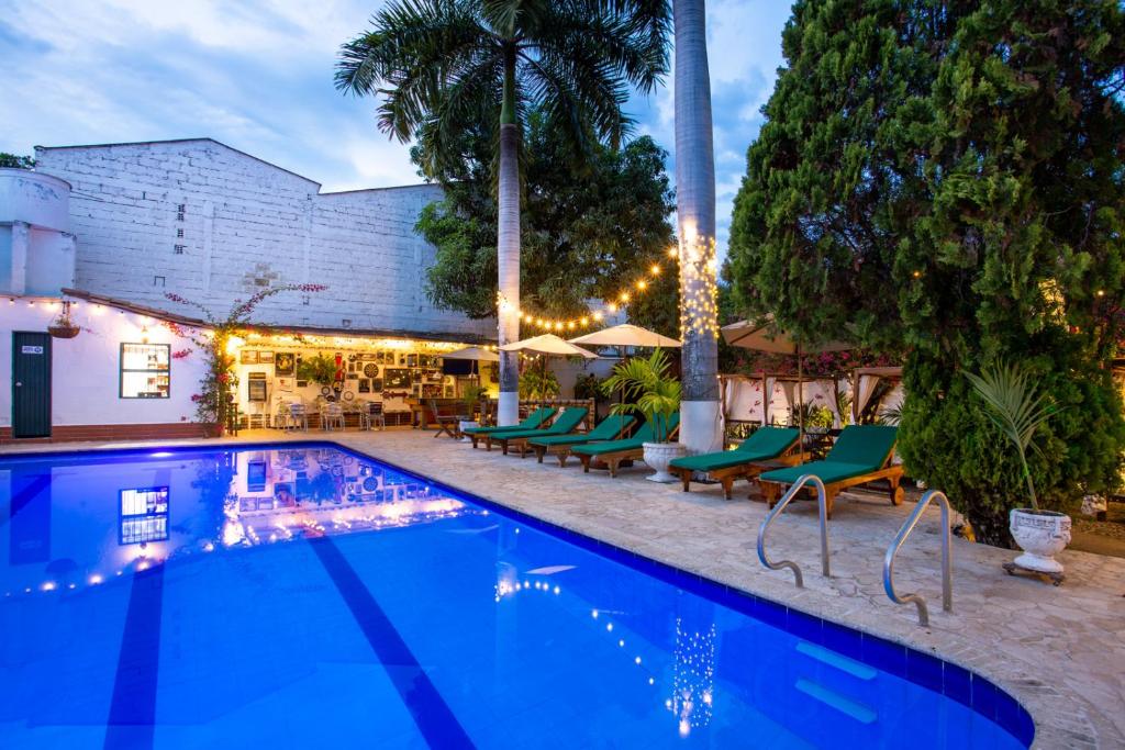 Bazén v ubytování Entre Palmas Casa Hotel nebo v jeho okolí