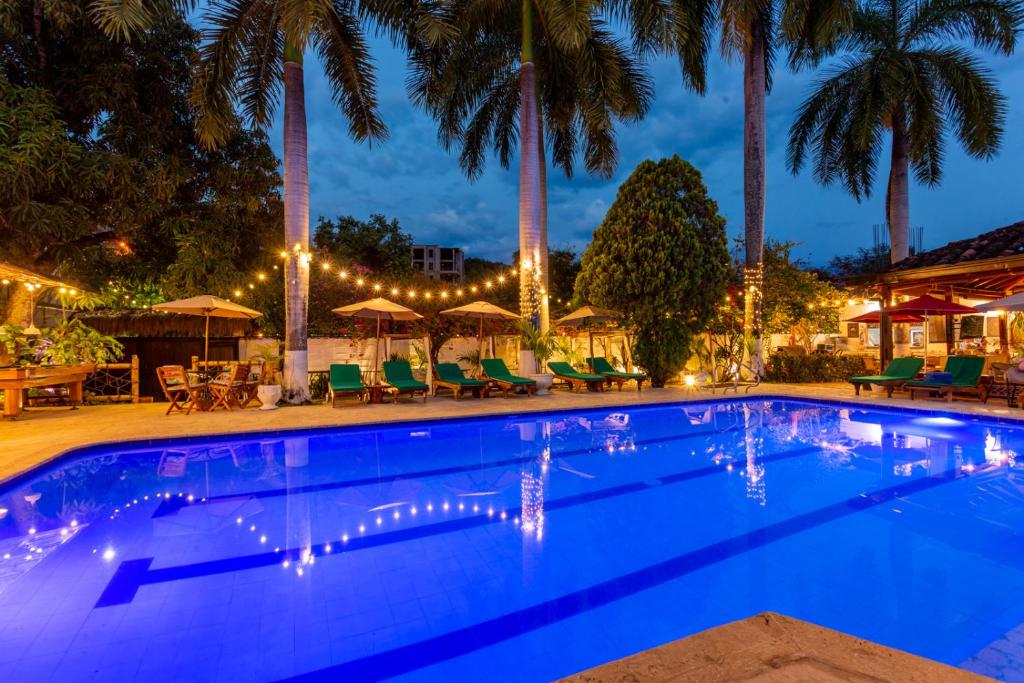 Bazén v ubytování Entre Palmas Casa Hotel nebo v jeho okolí
