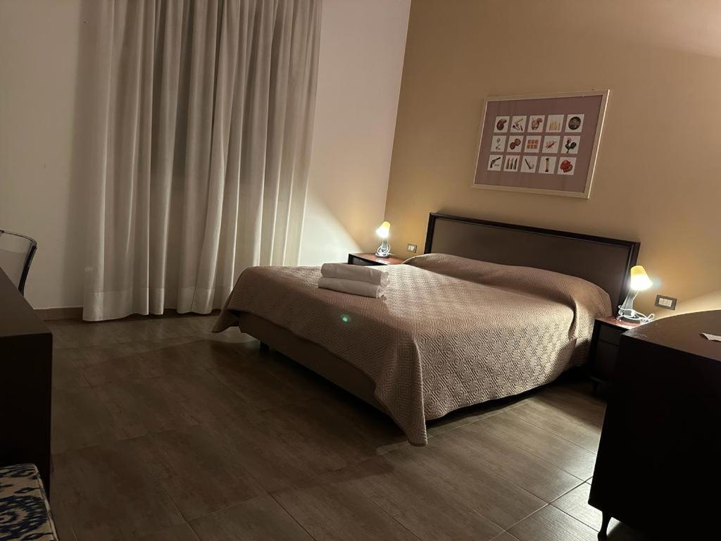 Postel nebo postele na pokoji v ubytování Hotel Le Calandre