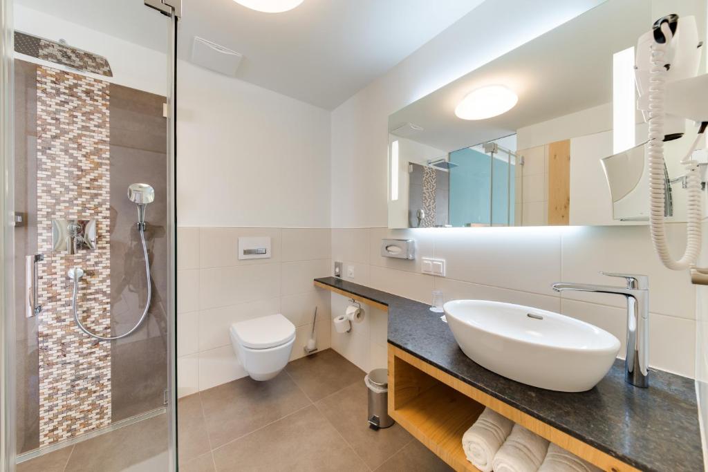 Koupelna v ubytování R&R Residenzen Aparthotel