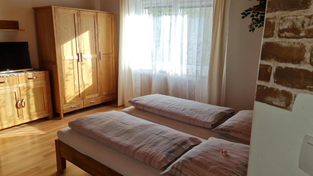 Postel nebo postele na pokoji v ubytování Urlaubsnest