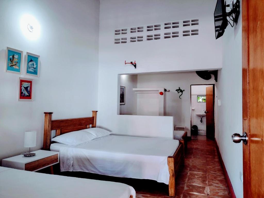 Postel nebo postele na pokoji v ubytování Hotel Refugio Bike
