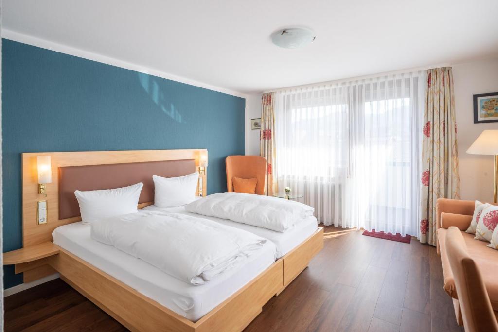 Postel nebo postele na pokoji v ubytování Hotel Fortuna
