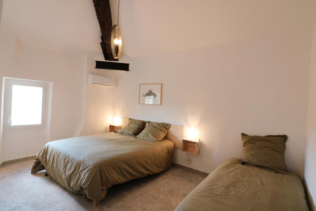 Posteľ alebo postele v izbe v ubytovaní Appartements à la ferme