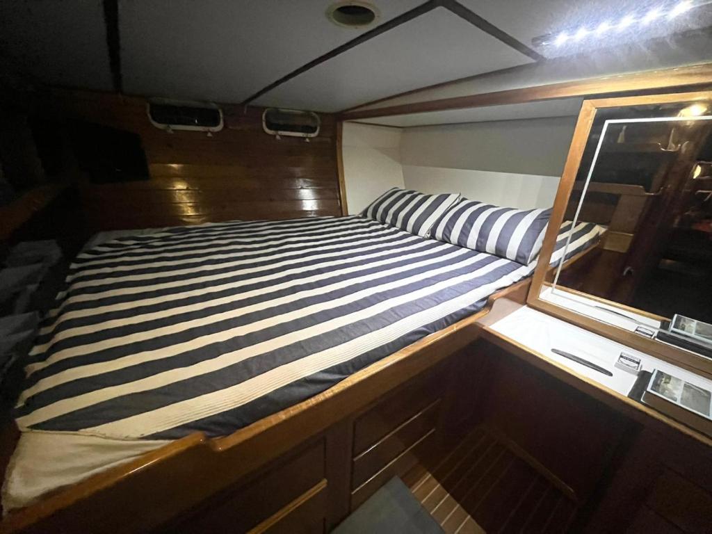 a bed in the back of a boat at Sailing Yacht in Fiskardo