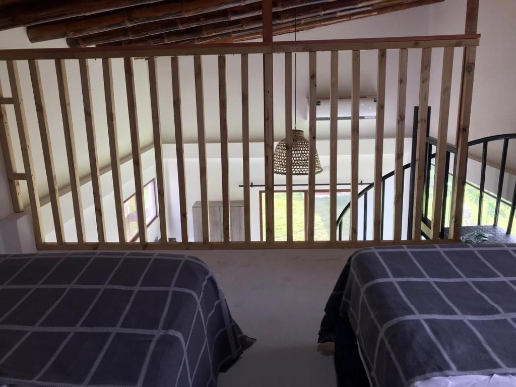 Postel nebo postele na pokoji v ubytování Las Cabañas