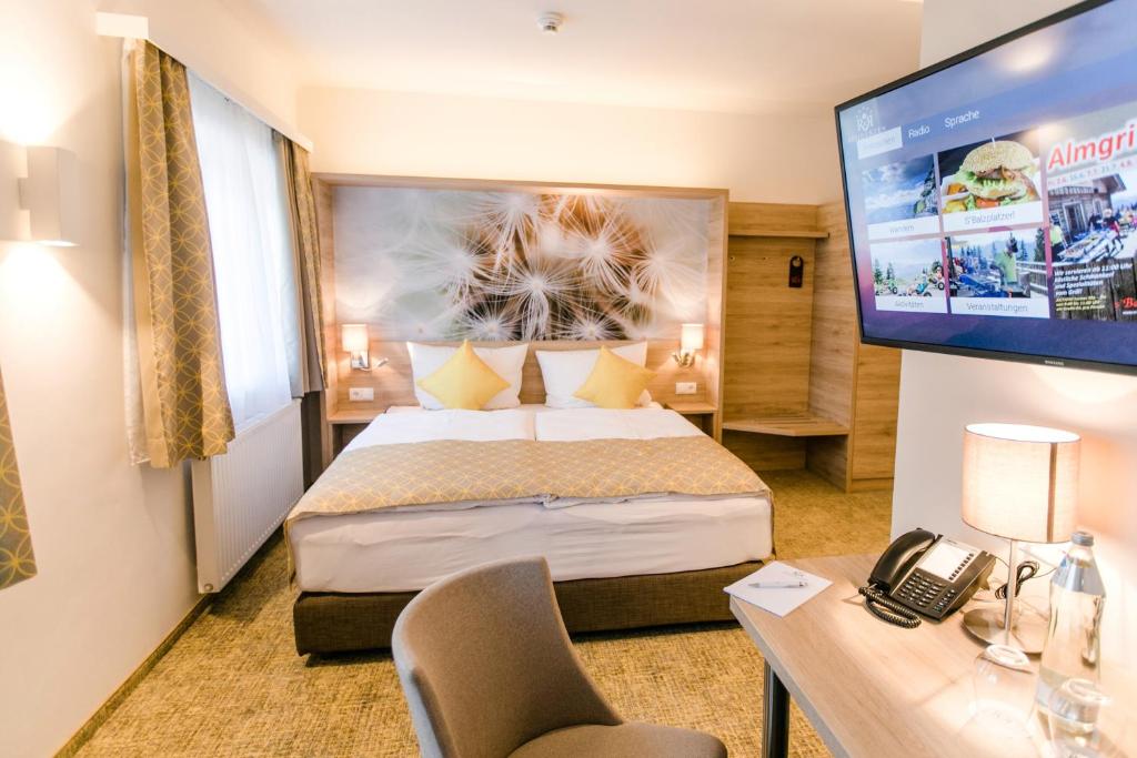 TV a/nebo společenská místnost v ubytování R&R Residenzen HOTEL