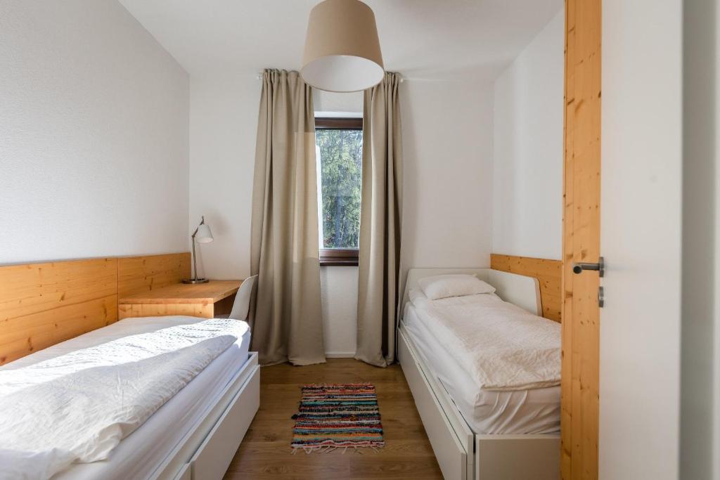 Postel nebo postele na pokoji v ubytování Lúčnica apartments Tále
