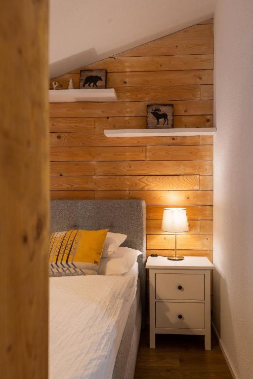 Postel nebo postele na pokoji v ubytování Lúčnica apartments Tále