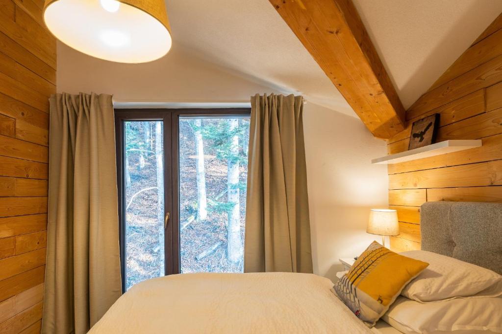 Postel nebo postele na pokoji v ubytování Lúčnica apartments Tále