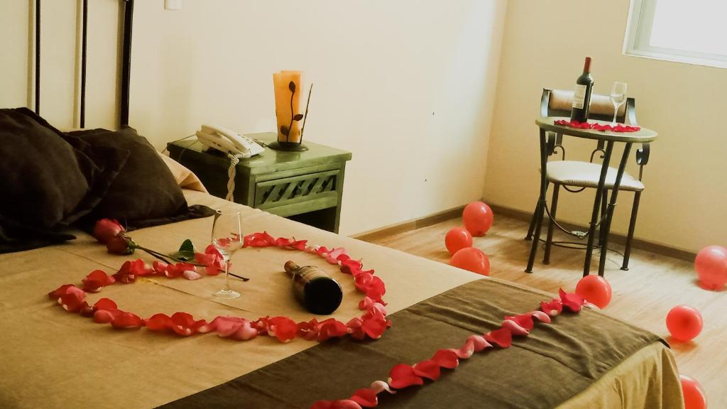 Postel nebo postele na pokoji v ubytování HOTEL PLAZA PACHUCA