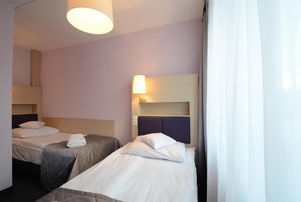 Posteľ alebo postele v izbe v ubytovaní Hotel PZMot