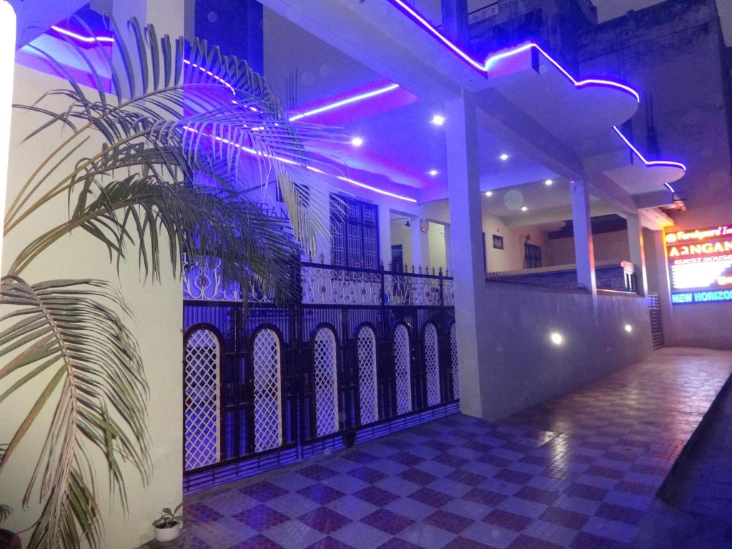 a house with a fence with purple lights at Foreigners' Inn in Varanasi