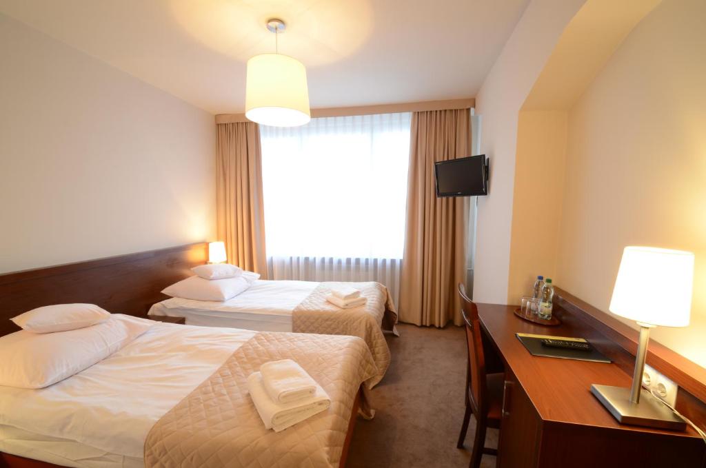 Posteľ alebo postele v izbe v ubytovaní Hotel PZMot