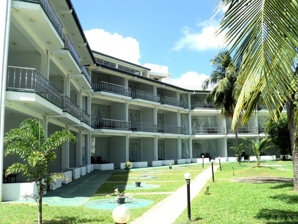 an exterior view of a building with a courtyard at Sea Lotus Park in Trincomalee