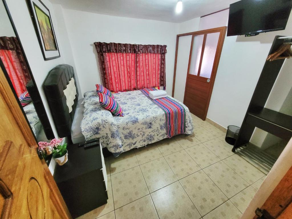 Postel nebo postele na pokoji v ubytování Hostal EL VIAJERO en Ollantaytambo