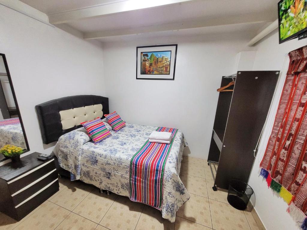 Postel nebo postele na pokoji v ubytování Hostal EL VIAJERO en Ollantaytambo