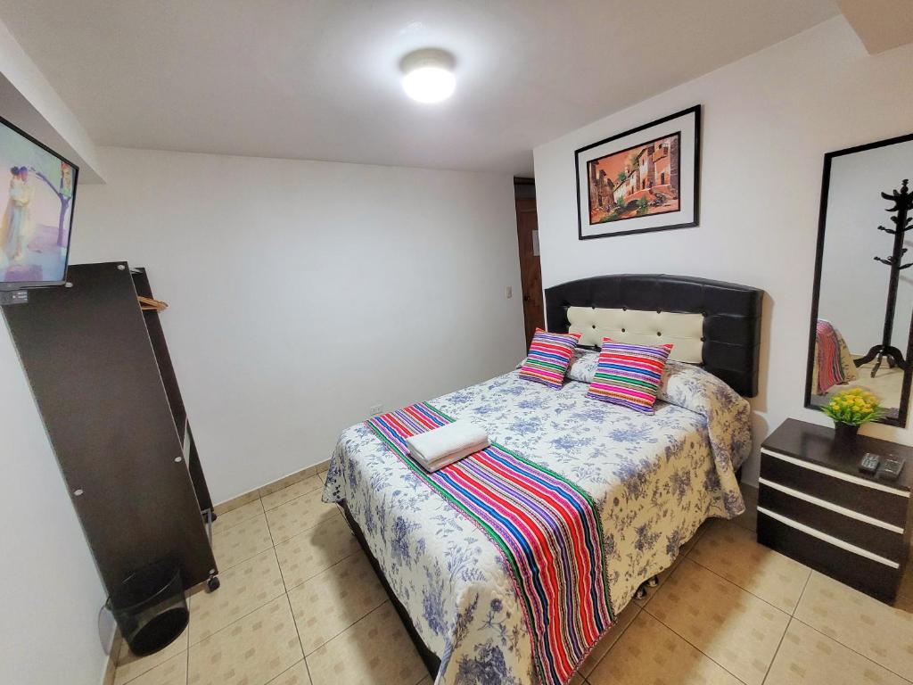 Postel nebo postele na pokoji v ubytování Hostal EL VIAJERO en Ollantaytambo
