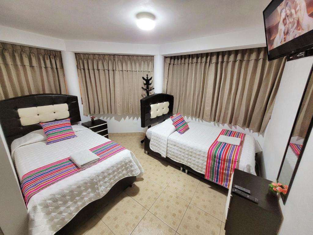 Postel nebo postele na pokoji v ubytování Hostal EL VIAJERO en Ollantaytambo
