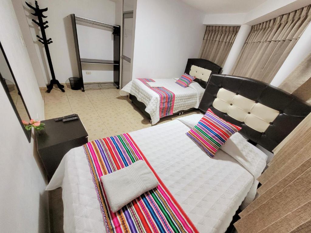 Postel nebo postele na pokoji v ubytování Hostal EL VIAJERO en Ollantaytambo