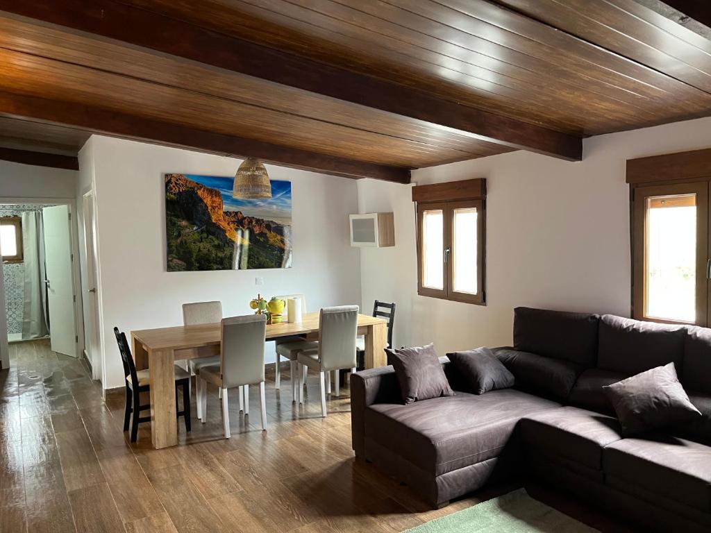 a living room with a couch and a table at El Caserio de Araña, Cercados de Araña in Los Cercados