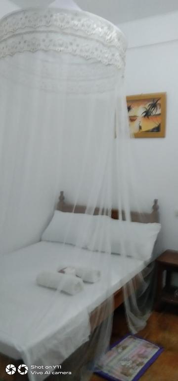 Postel nebo postele na pokoji v ubytování Jeno Tourist Inn