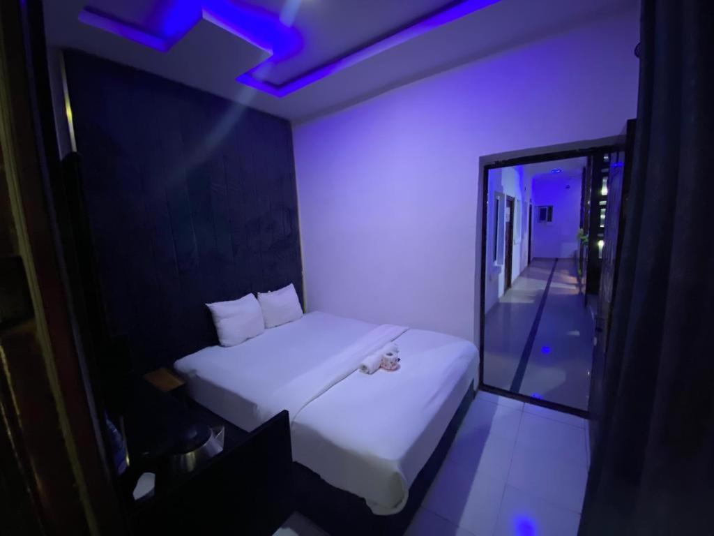 Postel nebo postele na pokoji v ubytování Palazzo Apartments