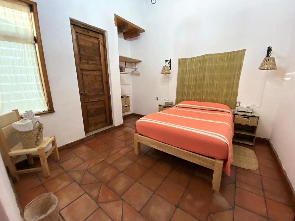 Postel nebo postele na pokoji v ubytování Posada El Palomar