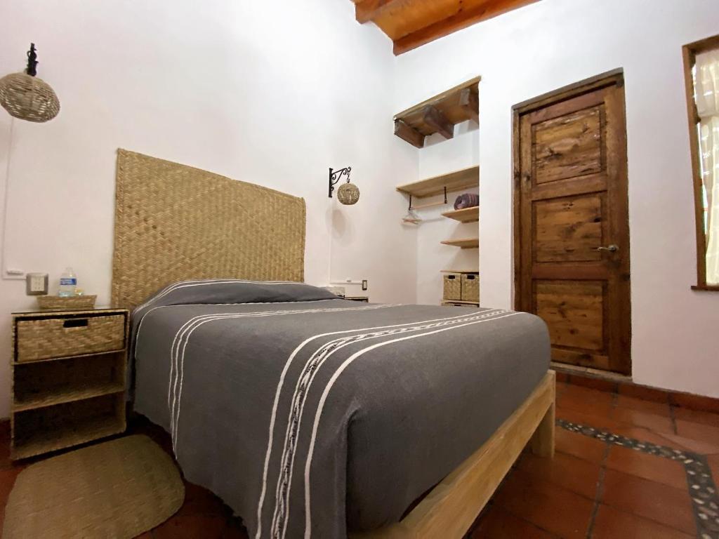 Postel nebo postele na pokoji v ubytování Posada El Palomar