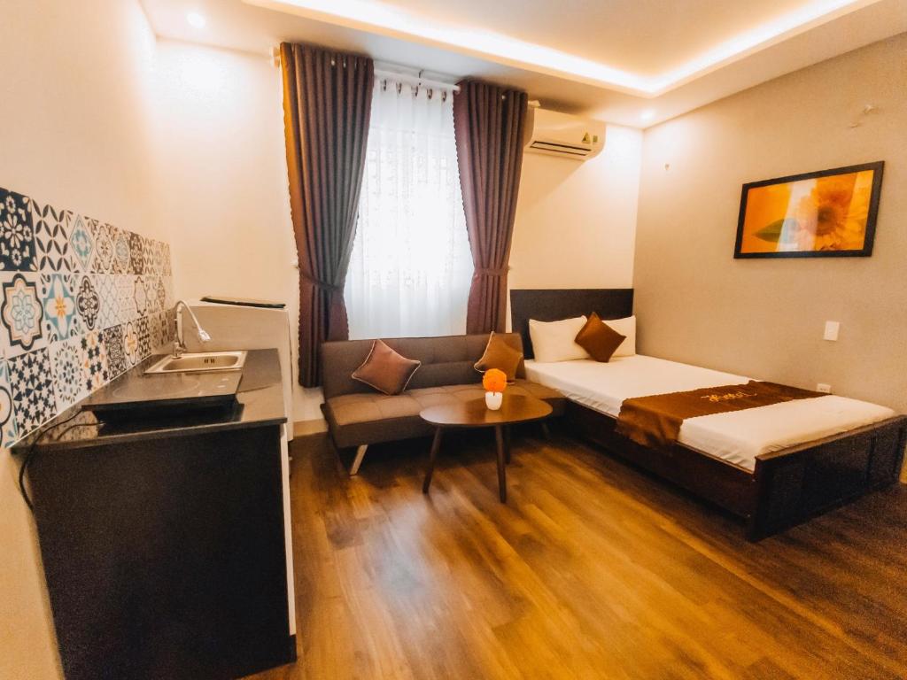 Postel nebo postele na pokoji v ubytování King Hotel Da Nang